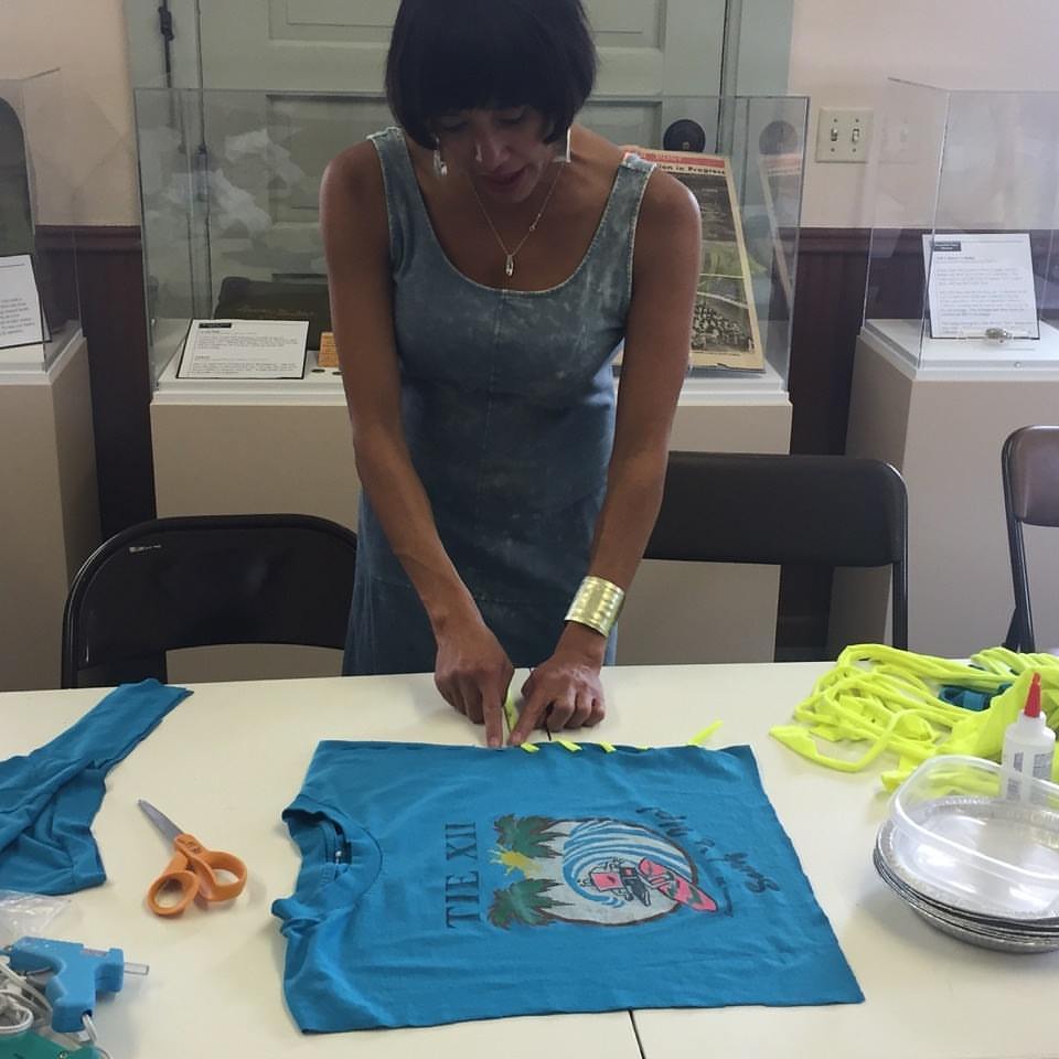 Brandi Shigley shows the Broomfield Museum Depot how to reconstruct t-shirts.